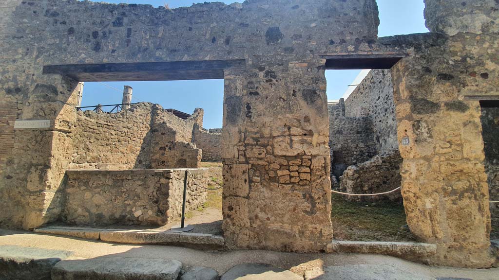 VII.1.44, on left, and VII.1.45, on right, Pompeii. July 2021. 
Looking towards entrance doorways on east side of Vicolo del Lupanare.
Foto Annette Haug, ERC Grant 681269 DÉCOR.