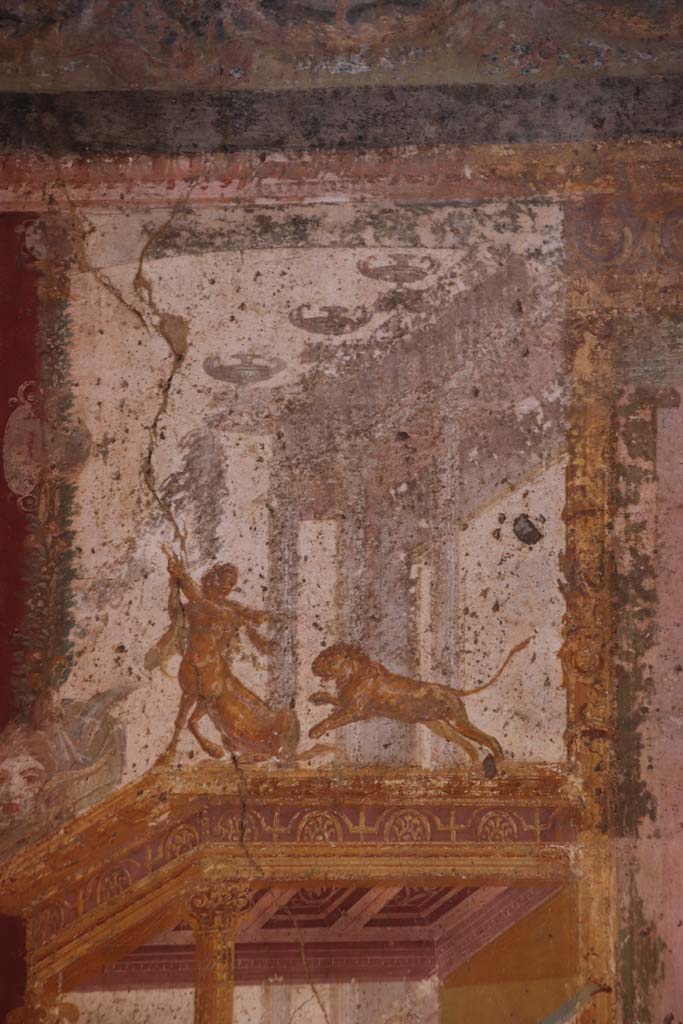 VII.1.47 Pompeii. September 2021.  
Exedra 10, detail showing Centaur and Lion from north wall at west end. Photo courtesy of Klaus Heese.