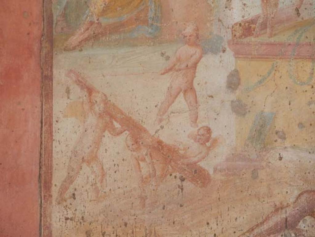 VII.1.47 Pompeii. May 2017. Exedra 10, detail from central painting on north wall.
Four Cupids are on the ground playing with the club of Hercules. 
Photo courtesy of Buzz Ferebee.