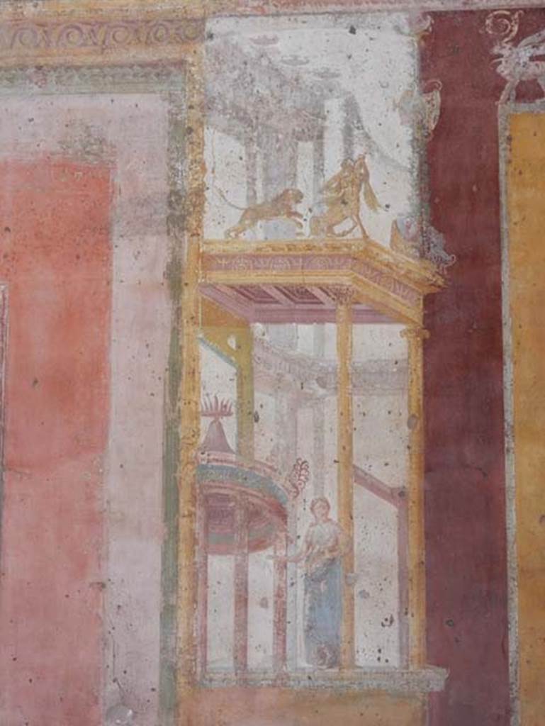 VII.1.47 Pompeii. May 2018. 
Exedra 10, detail figure of muse (Clio or Calliope?) in painted architectural decoration on east side of central painting on north wall.
Photo courtesy of Buzz Ferebee.   
See Helbig, W., 1868. Wandgemälde der vom Vesuv verschütteten Städte Campaniens. Leipzig: Breitkopf und Härtel, 860.
See Carratelli, G. P., 1990-2003. Pompei: Pitture e Mosaici: Vol VI. Roma: Istituto della enciclopedia italiana, p.269.