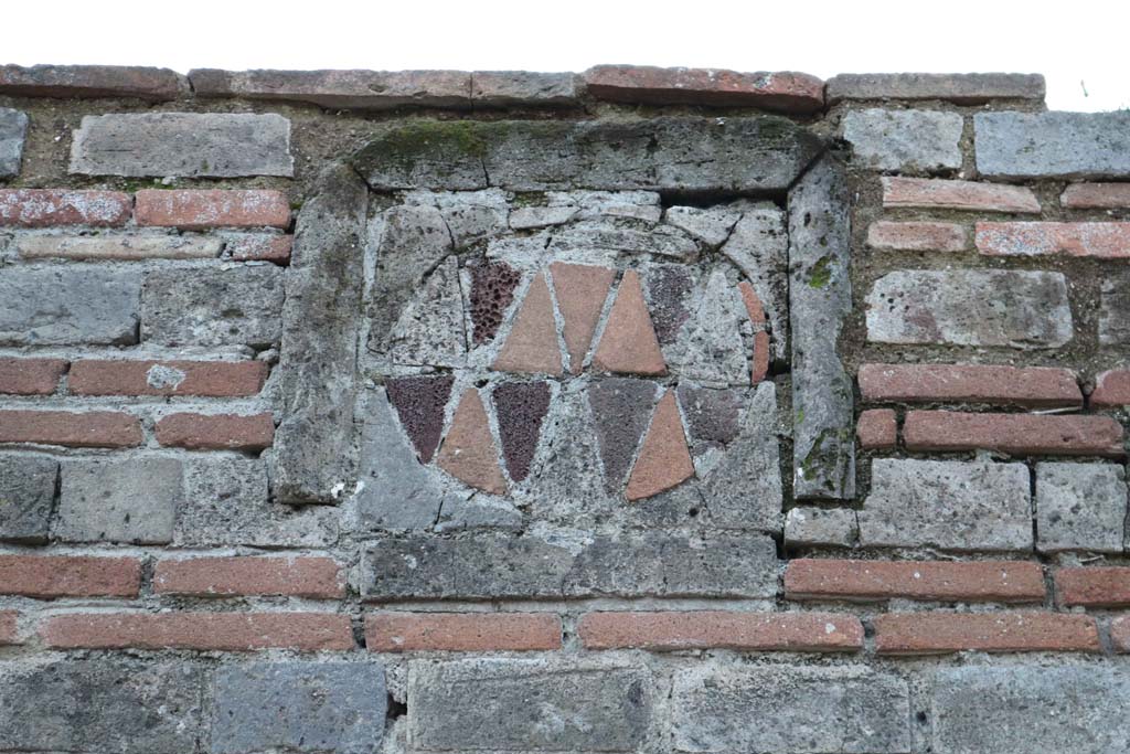 VII.2.1 Pompeii. December 2018. Looking west towards plaque on pilaster between VII.2.1 and VII.2.2. Photo courtesy of Aude Durand.