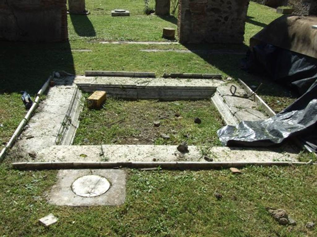 VII.2.16 Pompeii. March 2009. Room 2, marble impluvium and cistern mouth in atrium.