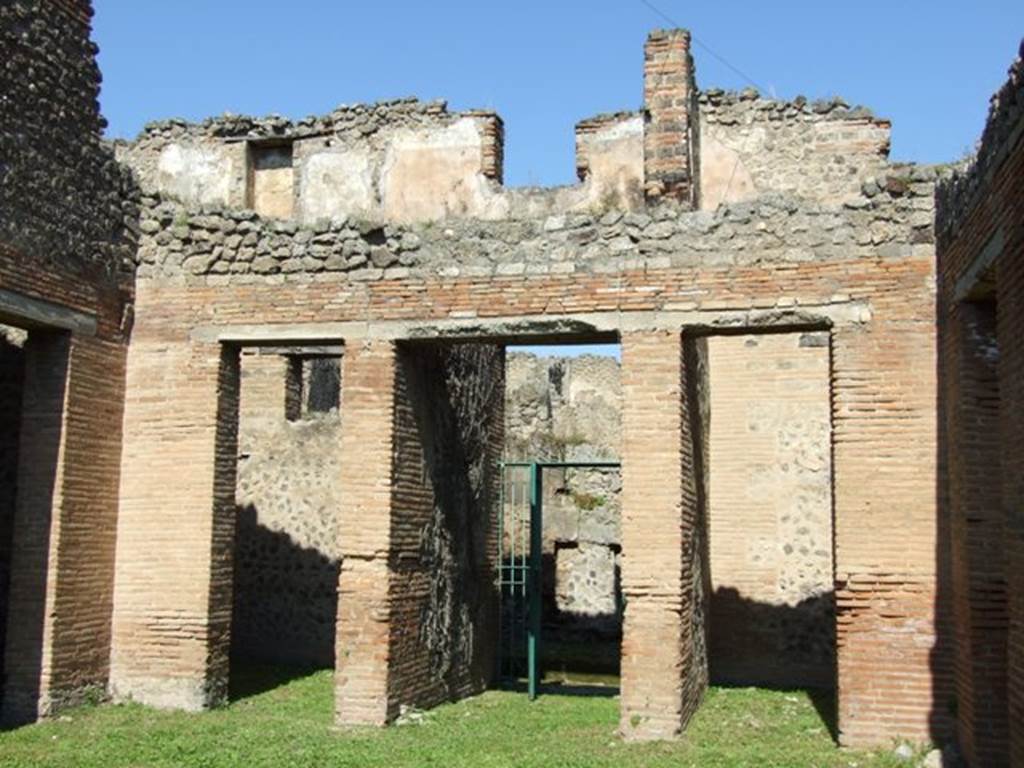VII.2.18 Pompeii. March 2009.  Room 1, atrium. Doorways on north wall and upper floor apartment above.