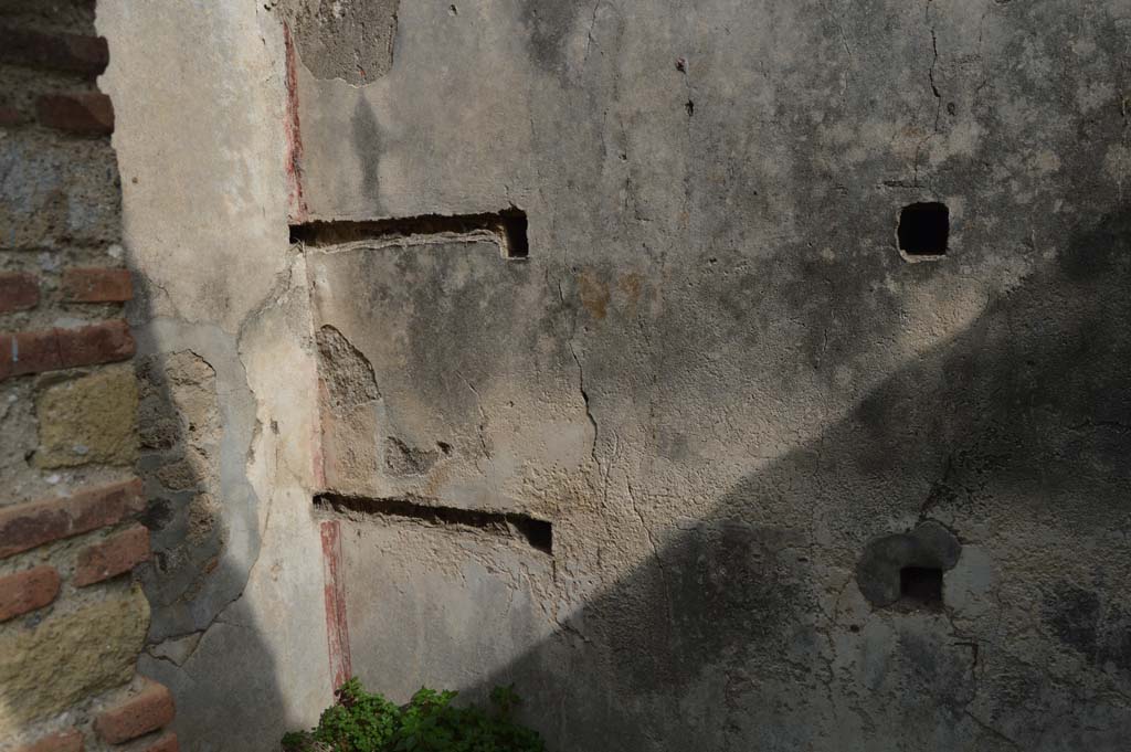 VII.2.18 Pompeii. October 2017. Room 13, looking towards north-east corner and east wall with holes for shelving supports.
Foto Taylor Lauritsen, ERC Grant 681269 DÉCOR.