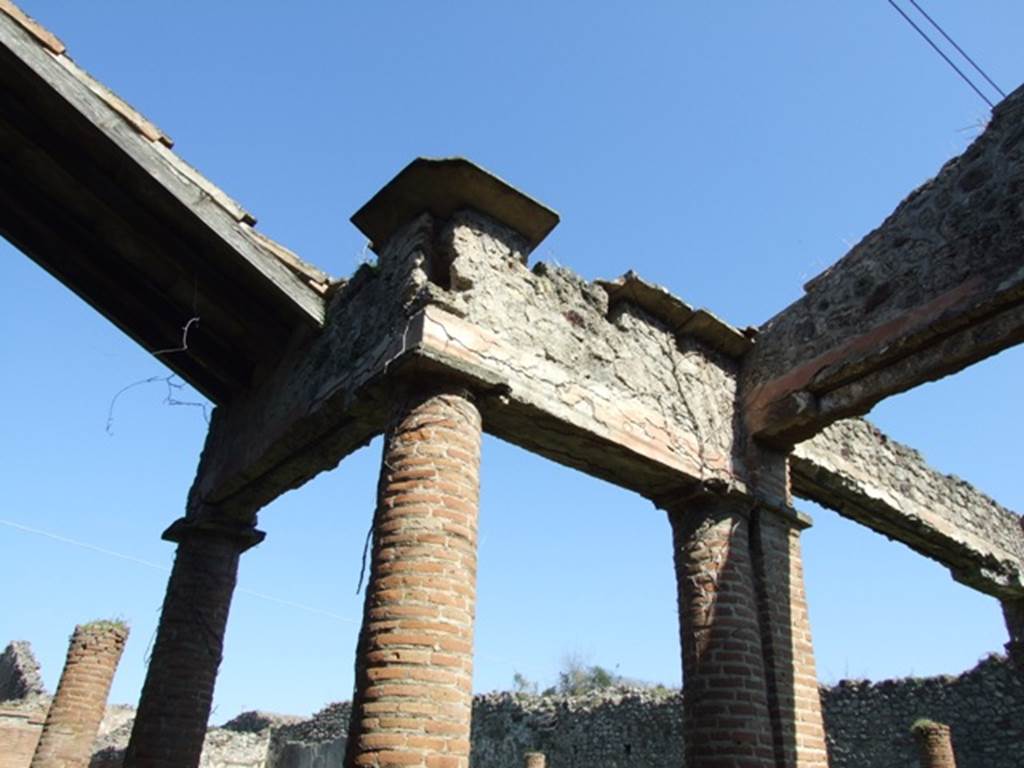 VII.2.18 Pompeii. March 2009. South portico, outside room 17.  Columns supporting the portico, reinforced by two pillars, one on the north and this one on the south side.