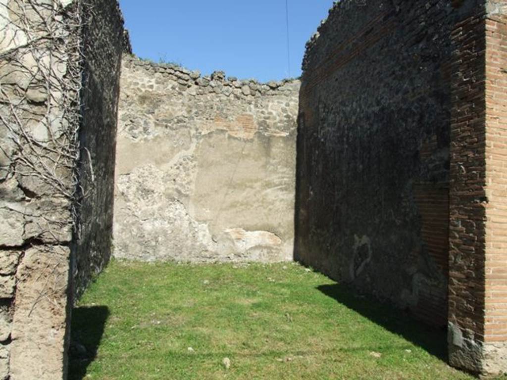 VII.2.18 Pompeii. March 2009. Room 21, triclinium. According to Richardson, when found, the floor of this room was paved with white mosaic around a panel of squares and triangles of coloured marble.  Also found here were the remains of three dining couches with beautiful mounts of bronze inlaid with silver. These have been reconstructed and are in the Naples Archaeological Museum.
Richardson, L., 1988. Pompeii: an Architectural History. Baltimore: John Hopkins University Press. (p.312)
According to Mau, the wooden frame and end board of one of the dining couches was completely charred, but the form was clearly indicated and the woodwork was restored.
See Mau, A., 1907, translated by Kelsey F. W. Pompeii: Its Life and Art. New York: Macmillan. (p.367-8, and fig. 188)