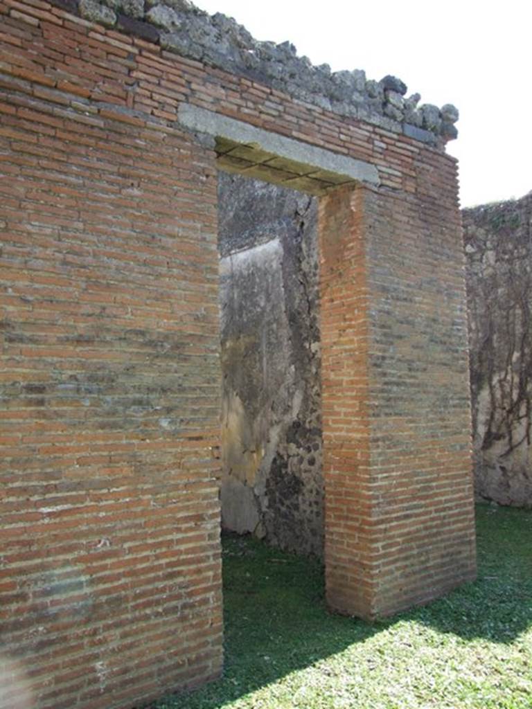 VII.2.18 Pompeii. March 2009. Doorway to room 4, cubiculum.
According to Richardson, in the second cubiculum on the east of the atrium were preserved remains of fine Third Style decoration with two large landscapes of fine quality. 
See Richardson, L., 1988. Pompeii: an Architectural History. Baltimore: John Hopkins University Press. (p.312)