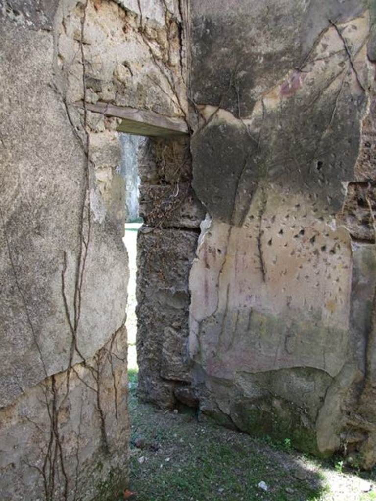 VII.2.20 Pompeii. March 2009.  Room 4, cubiculum showing small door to room 5, in south-west corner.