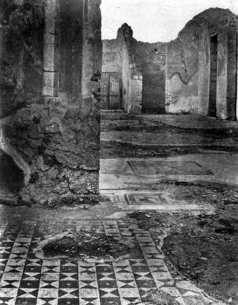 VII.2.20 Pompeii. c.1930. Looking north from room (13) behind tablinum towards atrium and entrance doorway. 
According to Blake –
We will make the one black and white mosaic in the group of coloured pavements of VII.2.20 which we have assigned to the pre-Roman period, our point of departure for this study.
In the room behind the tablinum, is a simple design in squares and triangles, which became exceedingly popular during the first century BC.
See Blake, M., (1930). The pavements of the Roman Buildings of the Republic and Early Empire. Rome, MAAR, 8, (p.78, pl.17, tav.3).