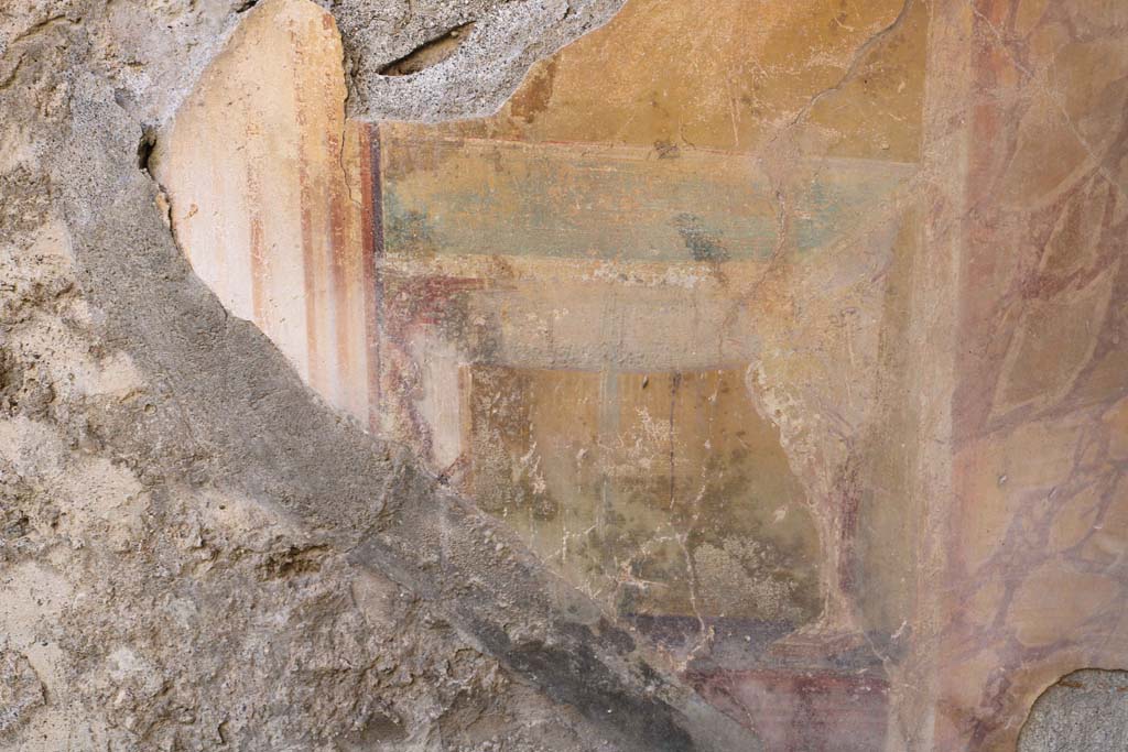 VII.2.20 Pompeii. December 2018. 
Tablinum 13, detail of painted decoration on west wall in north-west corner. Photo courtesy of Aude Durand.