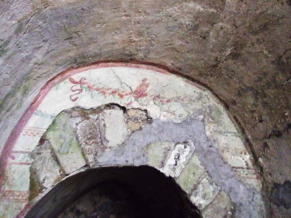 VII.2.20 Pompeii. December 2007. Painted garland above the offset doorway to the sacellum.