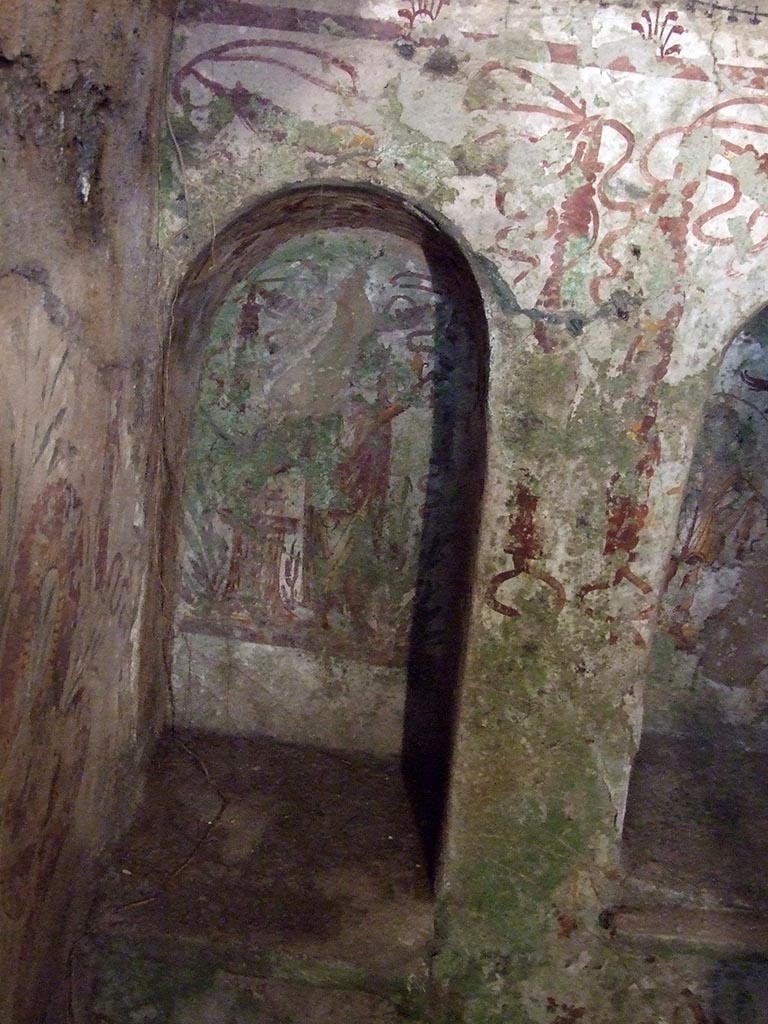VII.2.20 Pompeii. December 2007. Sacellum, niche to the left on north wall.
Boyce said that on the back wall of this niche was the Genius, togate and with a laurel wreath.
With his right hand he poured a libation over the flaming altar.
See Boyce G. K., 1937. Corpus of the Lararia of Pompeii. Rome: MAAR 14. (p.62, no.253, pl.41,2)