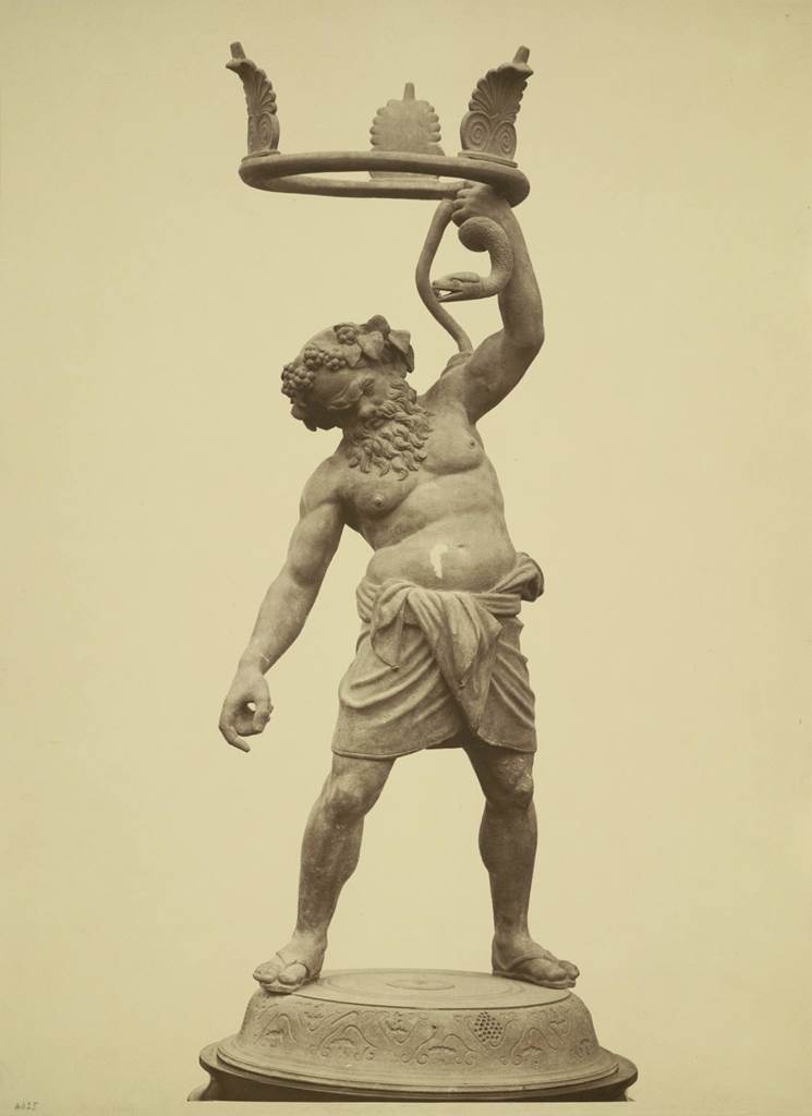 VII.2.20 Pompeii. Found 21st May 1864 in peristyle. Old undated photograph.
Bronze statue of Drunken Silenus, intended as a stand for a vase, of which the fragments were found nearby.
Now in Naples Archaeological Museum. Inventory number 5001.
See Real Museo Borbonico, Vol. XVI, tav. XXIX.
