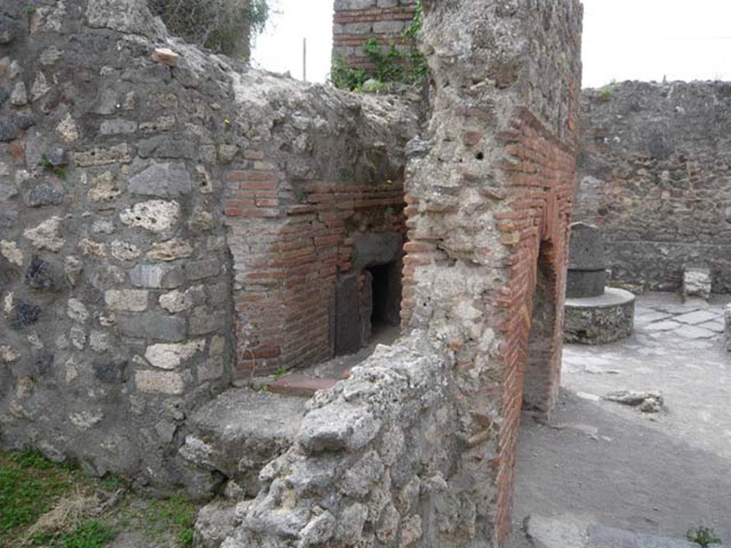 VII.2.22 Pompeii. May 2012. Looking south across front of oven, from north side.
Photo courtesy of Buzz Ferebee.