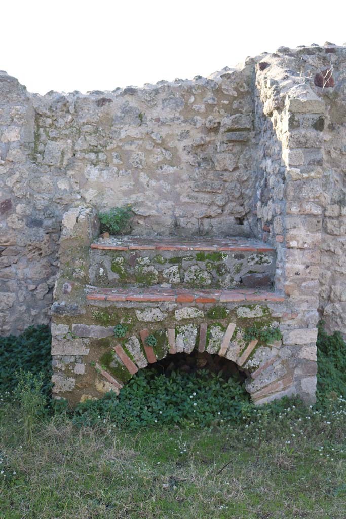 VII.3.9, Pompeii. December 2018. 
Looking west towards hearth or oven against west wall. Photo courtesy of Aude Durand.