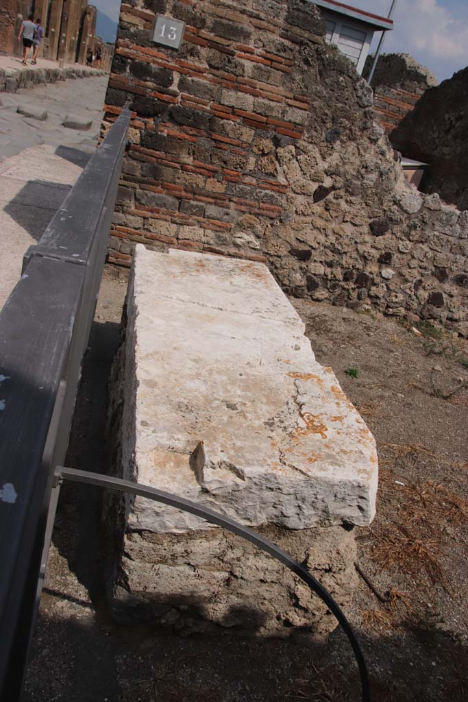 VII.3.13 Pompeii. September 2021. 
Looking east across marble podium at entrance doorway. Photo courtesy of Klaus Heese.