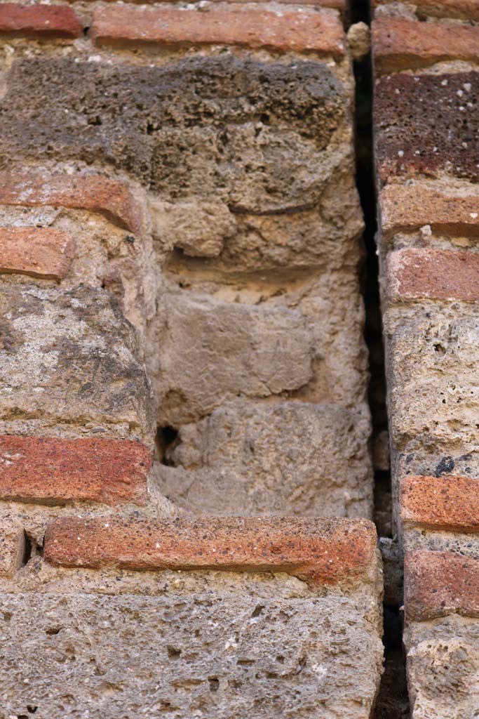 VII.3.23 Pompeii. December 2018. 
Detail from pilaster on north side of entrance doorway. Photo courtesy of Aude Durand.