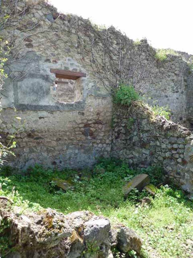 VII.3.23 Pompeii. May 2010. South-west corner of the triclinium, with the window in the  south wall overlooking the Vicolo del Panettiere.