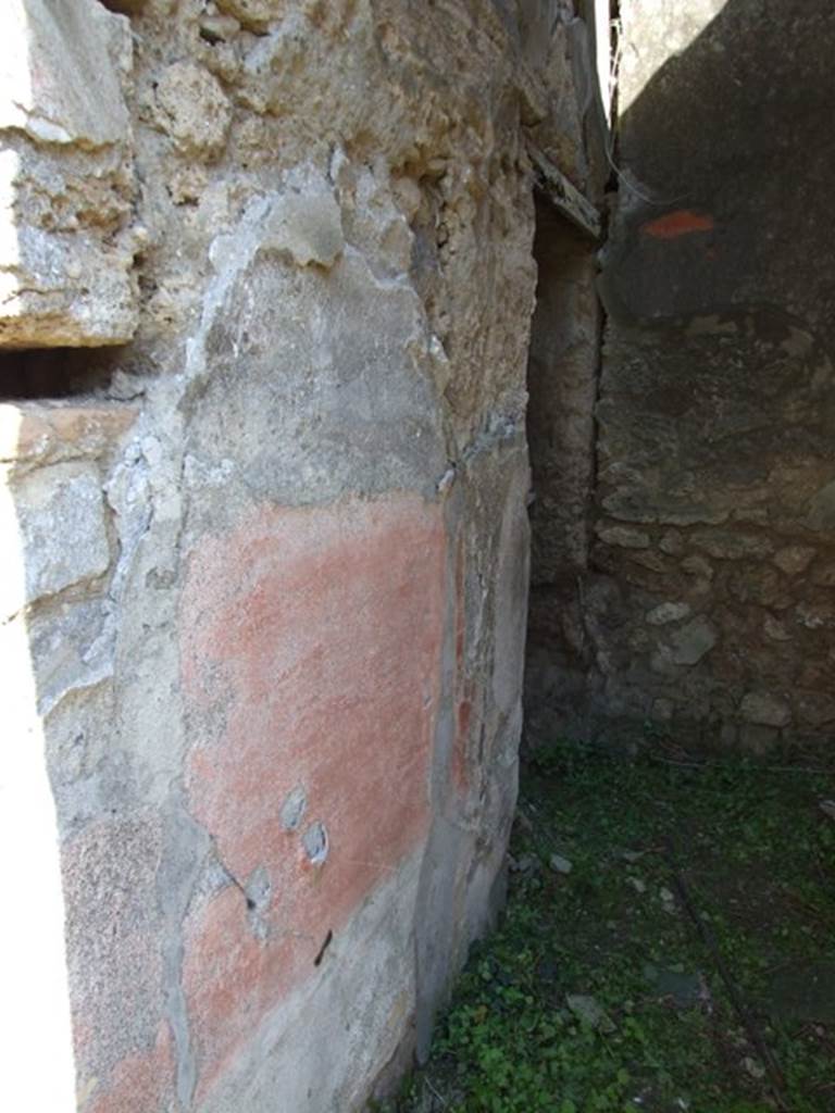 VII.3.29 Pompeii. March 2009. Room 12, north wall of corridor with doorway to garden area (no access). In this area were also an exedra or triclinium, another triclinium with window onto the garden and a niche shrine. According to Richardson, the best rooms of the house were a pair of dining rooms opening onto a small garden. These opened off a small square area that contained the lararium niche. The triclinium opened directly to the garden by  a large window with a low sill and had fine black and red decoration. The decoration was once very fine with large paintings in the centre panels, and delicate architecture in the upper zone.  Only ruins of this now remain but drawings were made of it when it was freshly excavated. Two paintings were taken to Naples Museum, inventory numbers 120085 and 120086. See Sogliano, A., 1879. Le pitture murali campane scoverte negli anni 1867-79. Napoli: (p. 101 no: 548 – 120085, and p.126 no: 616 – 120086)  See Richardson, L., 1988. Pompeii: an Architectural History. Baltimore: John Hopkins University Press. (p. 222-3)