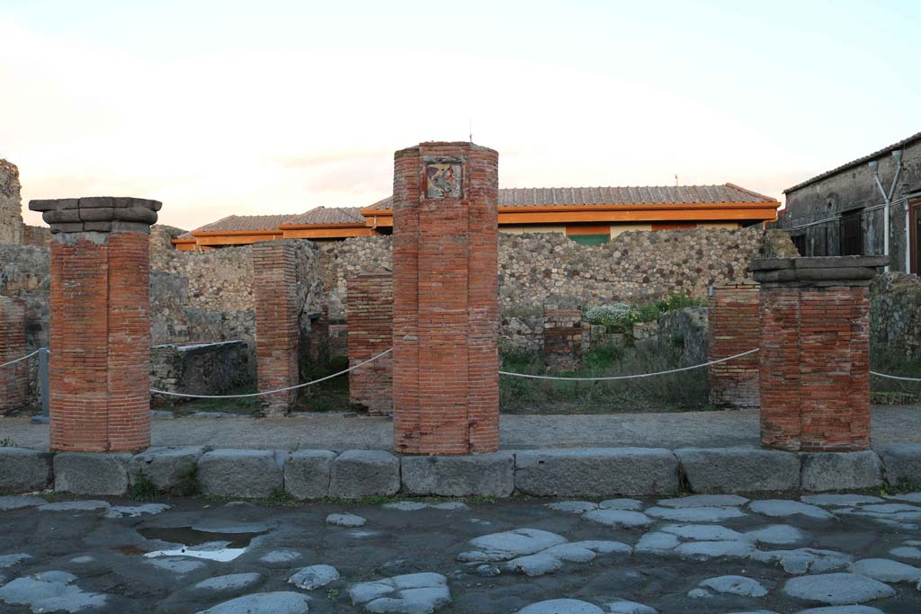 VII.4.6 Pompeii, on right of pilaster. December 2018. 
Looking east towards entrance doorway behind portico on Via del Foro. Photo courtesy of Aude Durand.