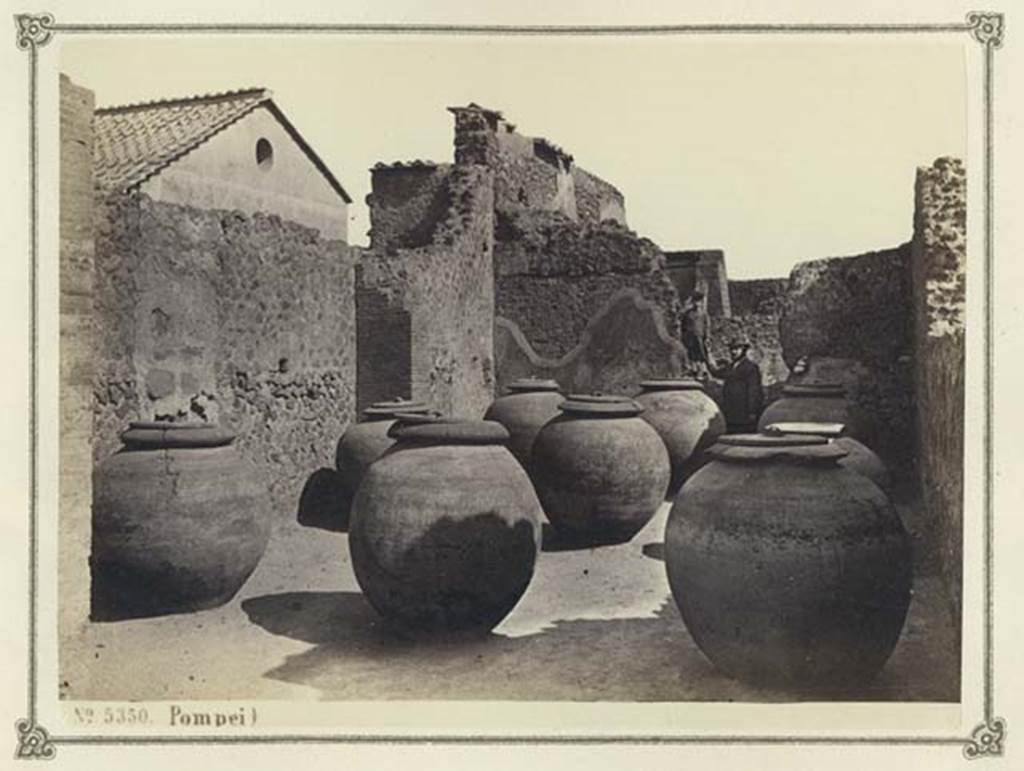 VII.4.13 Pompeii. Album dated January 1874. Looking east towards shop with large dolia. Photo courtesy of Rick Bauer.