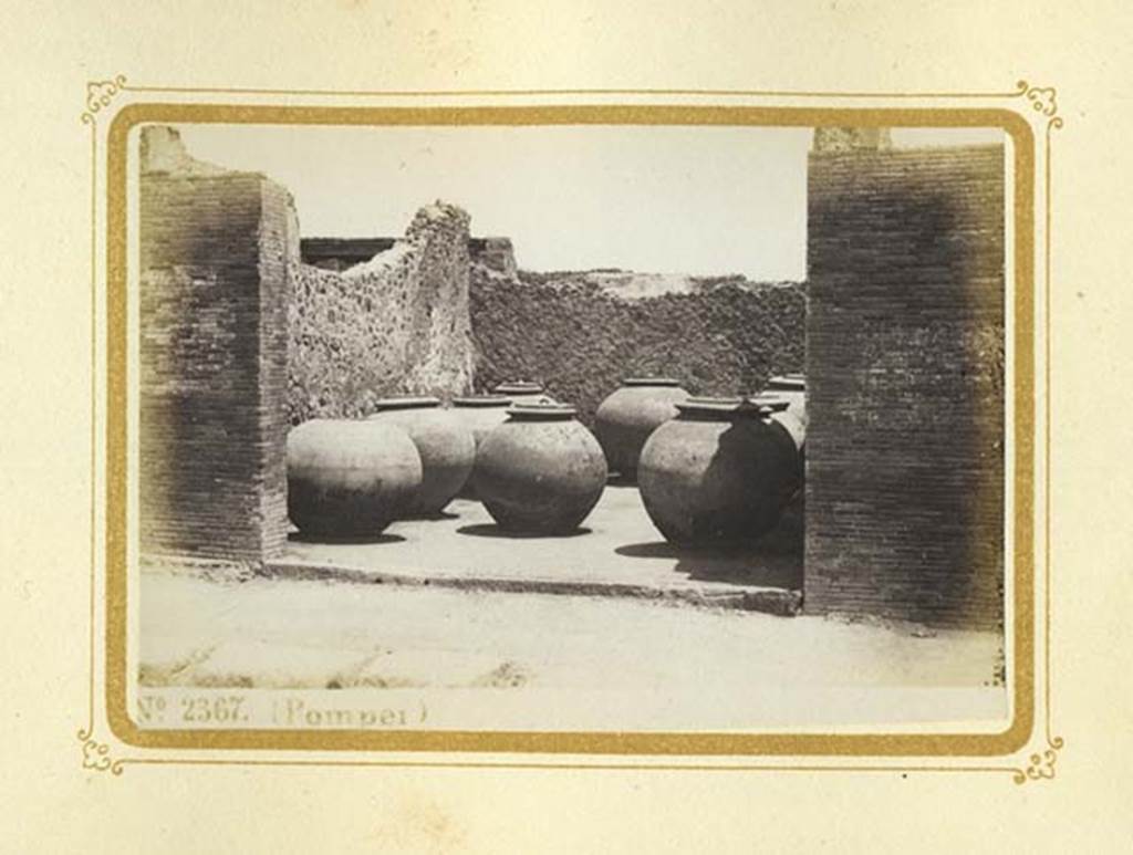 VII.4.14 Pompeii. Album dated January 1875. Looking east towards large dolia.
Photo courtesy of Rick Bauer.