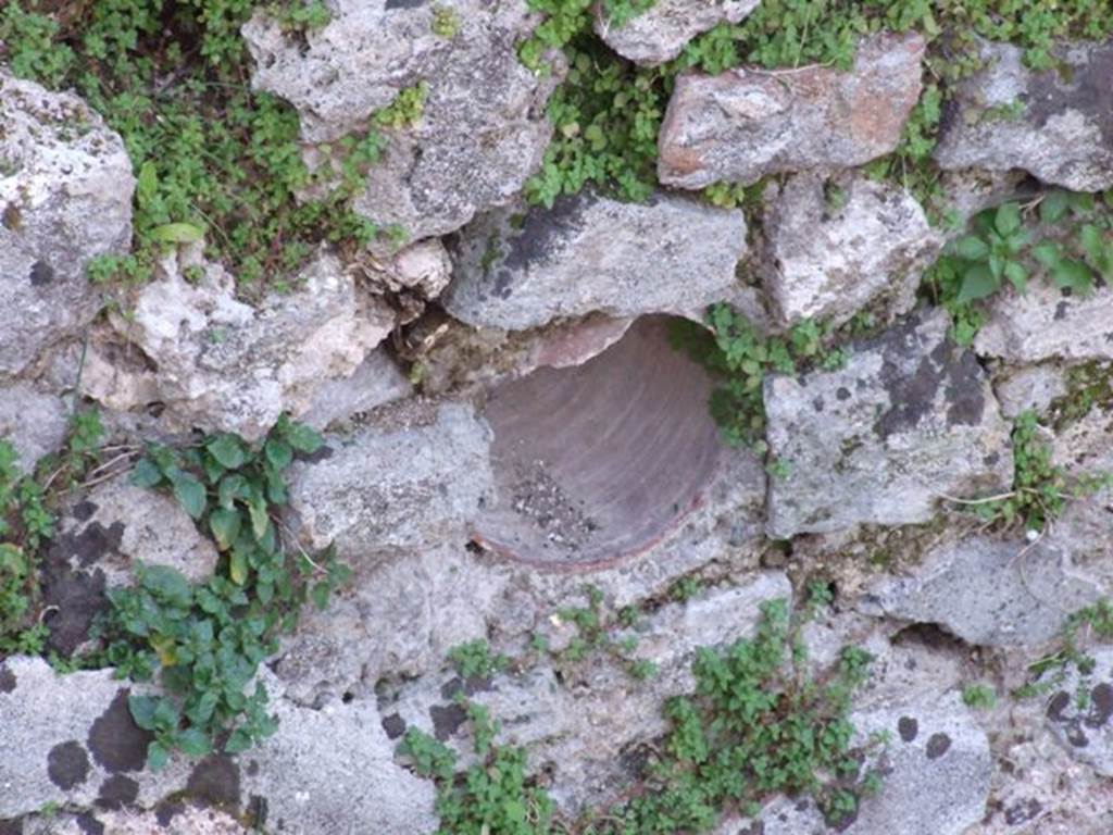 VII.4.31 Pompeii. March 2009. Middle peristyle.  West side of fish pool with amphora inserted in pool walls for fishes to shelter and to breed.
