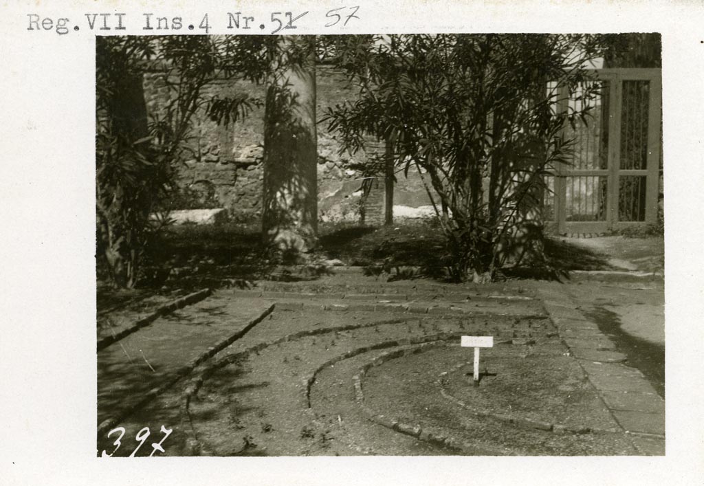 VII.4.31/51 Pompeii, although shown as VII.4.57 on photo. Pre-1937-39. 
Looking north across brick-edged planting bed, towards doorway at VII.4.51, on right.
Photo courtesy of American Academy in Rome, Photographic Archive. Warsher collection no. 397.