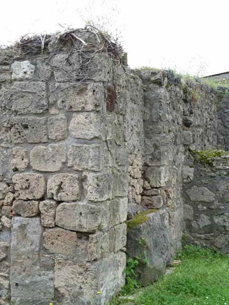 VII.4.31/51 Pompeii. May 2010. Room 2, south-west corner of atrium, with money-chest base against wall.