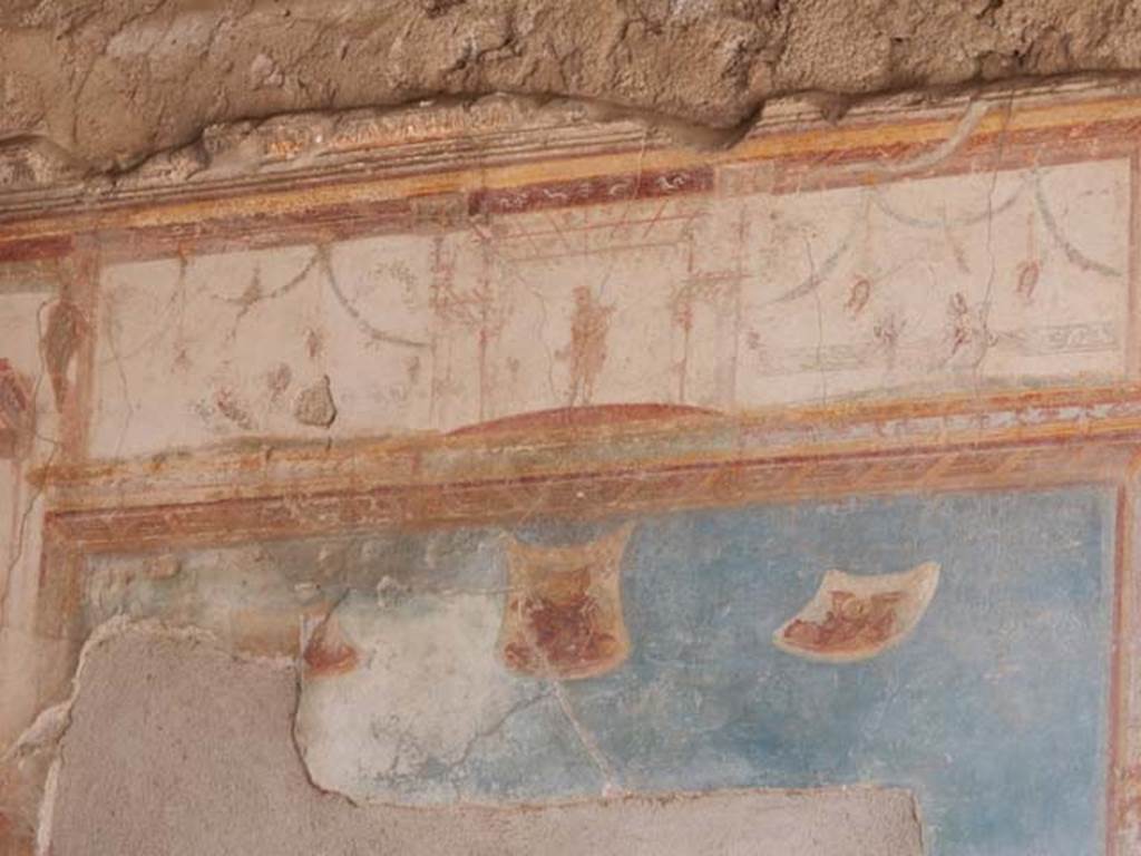 VII.4.48 Pompeii. May 2015. Room 11, upper west wall in centre .
Photo courtesy of Buzz Ferebee.
