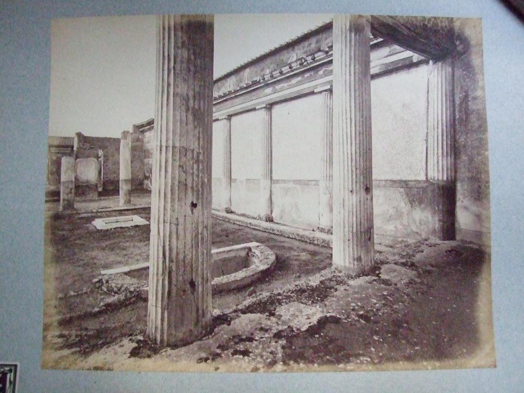 VII.4.59 Pompeii. House of the Black Wall, c.1862. Looking north in peristyle o. The east side having a wall with half columns against it. 
Photograph courtesy of Society of Antiquaries. Fox Collection.
See Garcia y Garcia, L., 2006. Danni di guerra a Pompei. Rome: L’Erma di Bretschneider, p.100, fig. 222.