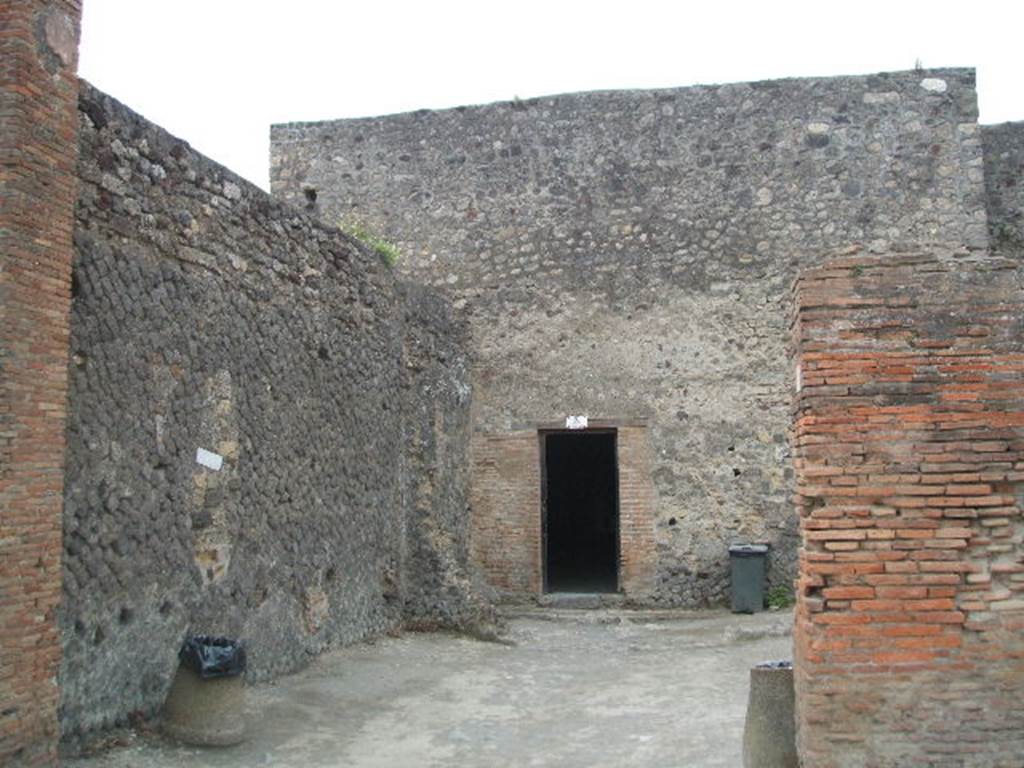 VII.5.3 Pompeii. May 2005. Shop with modern exit from Forum Baths.
A description, and photograph (figure 15 on page 138) can be found on page 137-8 of Associazione Internazionale Amici di Pompei: Quaderni di Studi Pompeiani, 1/2007.
Barattolo, A and Romaldi, F: Insula VII.5 – Una rilettura ragionata dei documenti grafici. (p.127-146)