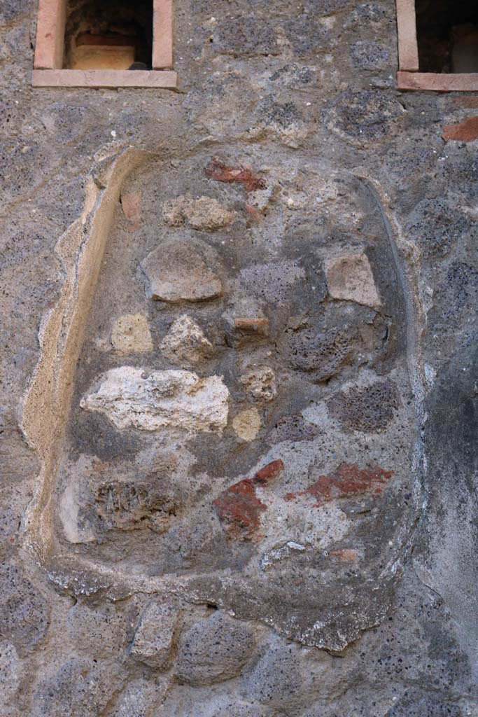 VII.5.22, Pompeii. December 2018. 
Filled-in niche in west wall, below holes for support beams for an upper floor.
Photo courtesy of Aude Durand.