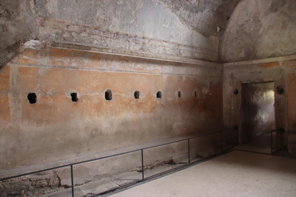VII.5.24 Pompeii. May 2024. 
Looking towards south-east corner along east wall of changing room (14) with benches. Photo courtesy of Klaus Heese.