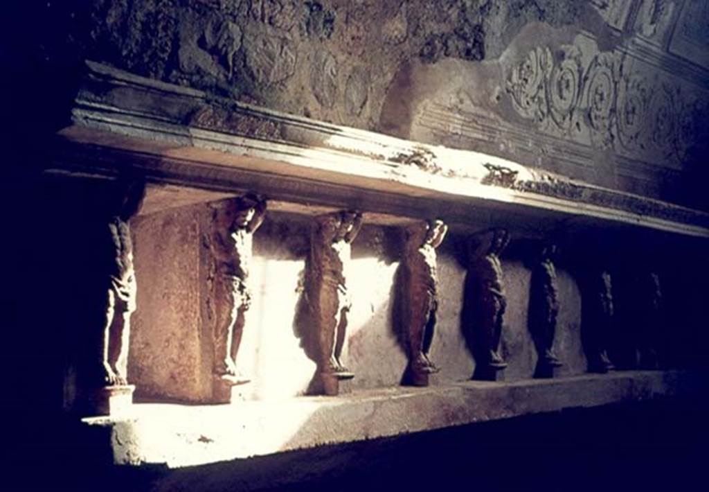 VII.5.24 Pompeii. January 1977. Tepidarium, east wall with telamons.  Photo courtesy of David Hingston.