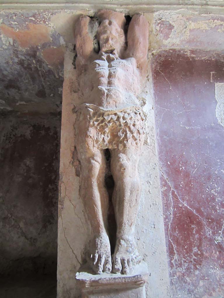 VII.5.24 Pompeii. March 2012. 
Detail of a telamon on east wall in the tepidarium (37). Photo courtesy of Marina Fuxa.
