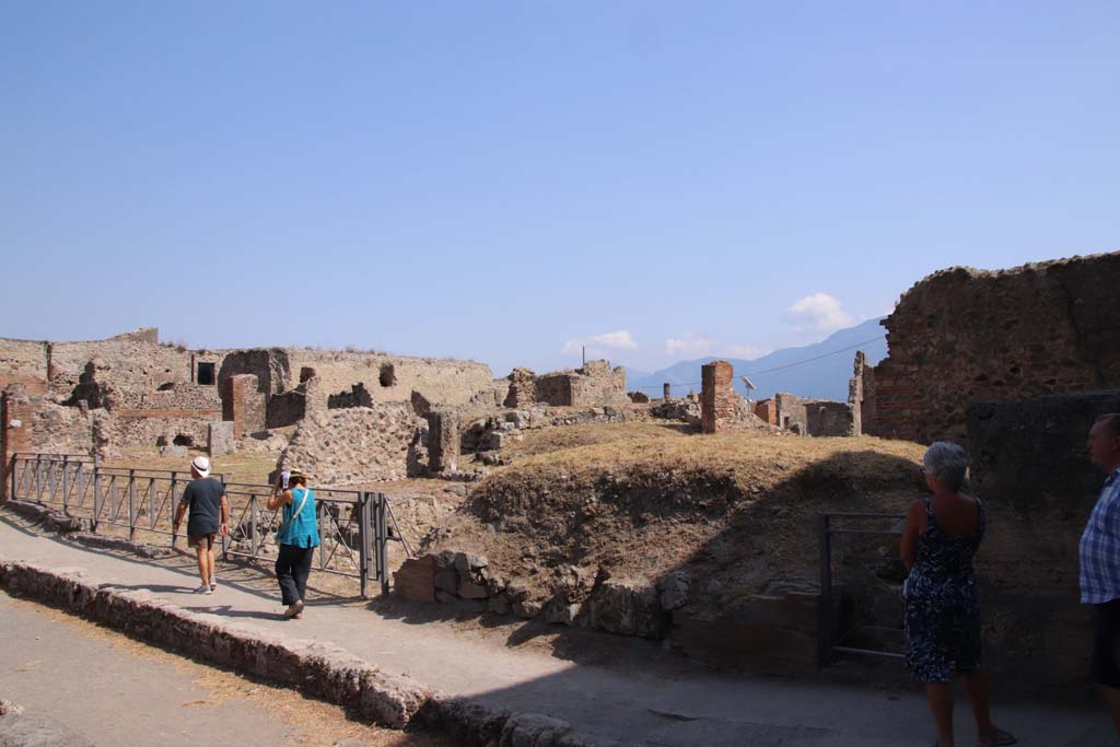 VII.6.1, Pompeii, doorway on right. September 2019. 
Looking south-east across VII.6 on south side of Via delle Terme, from junction with Vicolo del Farmacista, on right.
Photo courtesy of Klaus Heese.