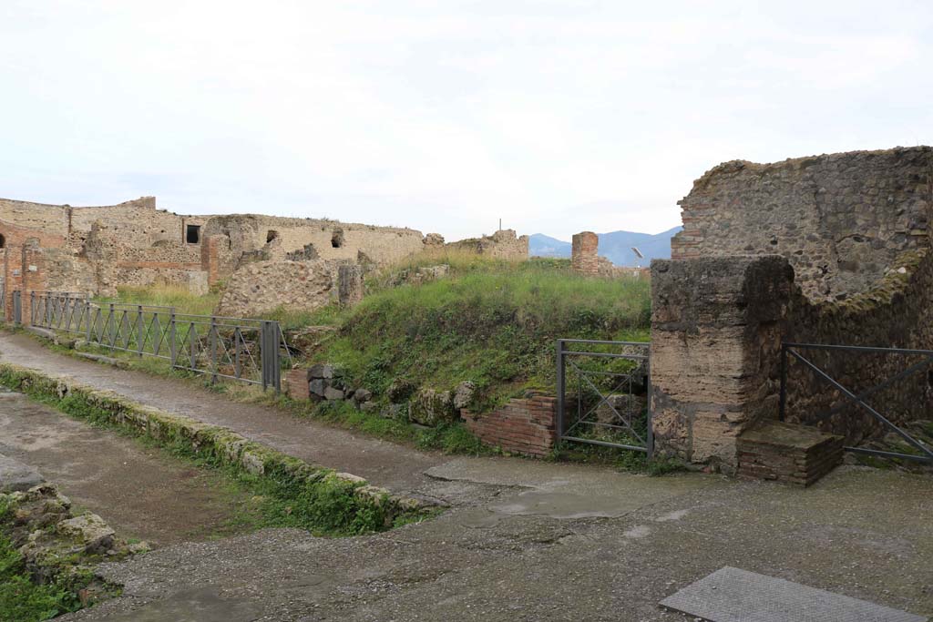 VII.6.1, Pompeii, doorway on right near Vicolo del Farmacista. December 2018.  
Looking south-east across VII.6 on south side of Via delle Terme, from junction with Vicolo del Farmacista, on right.
Photo courtesy of Aude Durand.
