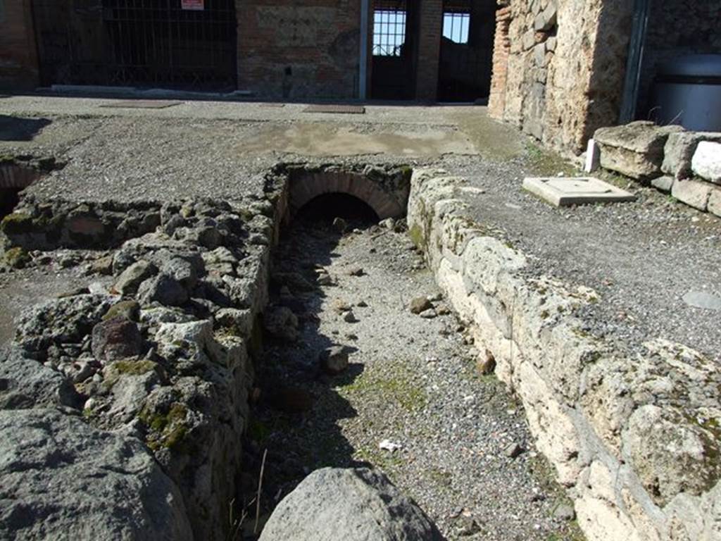 VII.6.1 Pompeii. March 2009.  Road drainage.  North side near VI.4.
Looking west to the end of the Via delle Terme, where it joins Vicolo del Farmacista.