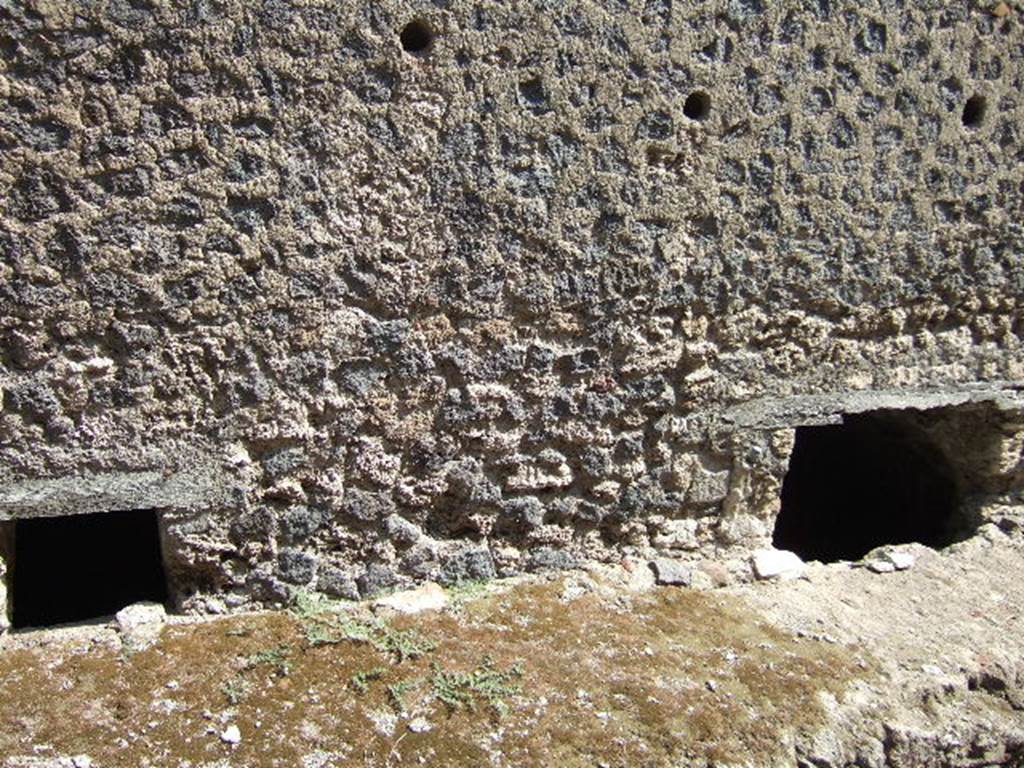 VII.6.3 Pompeii. September 2005. Windows of underground rooms (j) bath and (g) kitchen, These are at pavement level in the outside wall on Vicolo del Farmacista.