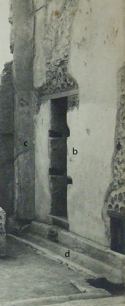 VII.6.3 Pompeii. Detail from Notizie degli Scavi, 1910, fig.2, p.443. 
Doorway with lava threshold and two crossbars of wood (fig.2 b).
On the right is the window at soil-level.