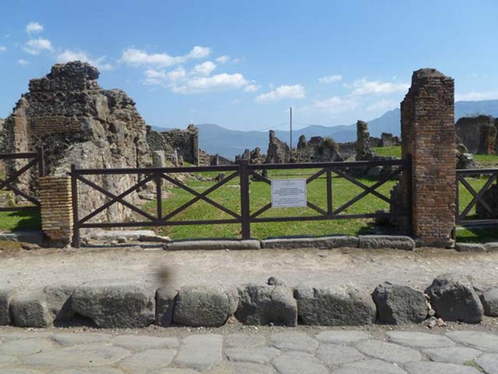 VII.6.9/8 Pompeii. May 2011. Looking south towards entrance doorways. The base-step of the stairs to the upper floor at VII.6.9 can  be seen on the left of the wider entrance of the shop at VII.6.8. Photo courtesy of Michael Binns.