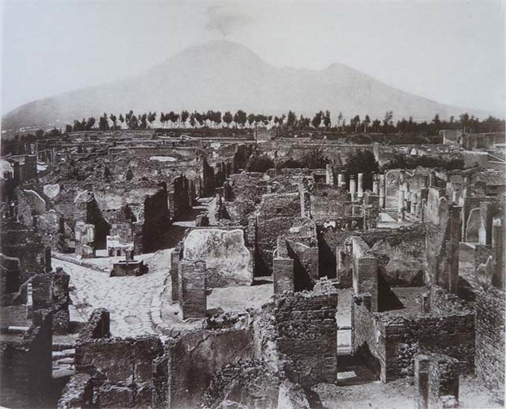 VII.6.11 Pompeii. Photo of abt.1870. Looking north across north side of insula VII.6. The entrance corridor of VII.6.11 can be seen on the right of the photo, leading into the atrium. The brick pilaster can again be seen in the lower right of the photo.