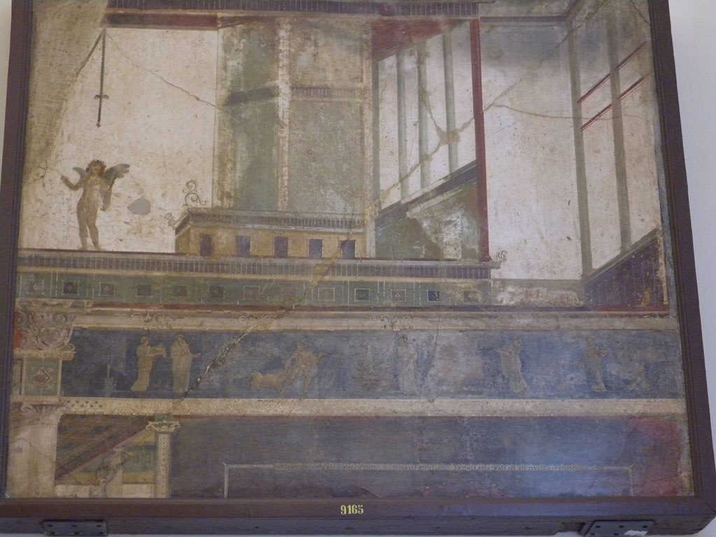 VII.6.28 Pompeii. Found on 10th April 1762. Architectural painting representing 5 doors, columns, capitals, bands and cornices of architecture; above a band is a naked cupid with a stick in the left and an object in the right; bottom scenes of sacrifice.
Now in Naples Archaeological Museum. Inventory number 9165.
See Antichità di Ercolano: Tomo Quarto: Le Pitture 4, 1765, 45-46, 221-227.
See Helbig, W., 1868. Wandgemälde der vom Vesuv verschütteten Städte Campaniens. Leipzig: Breitkopf und Härtel, (569).