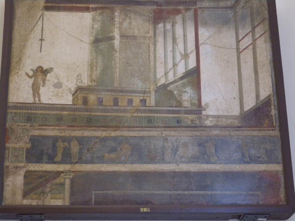 VII.6.28 Pompeii. Found 10th April 1762 in cubiculum 8.  One of four paintings found on the same wall. Wall painting of architectural scene with cupid. See Helbig, W., 1868. Wandgemälde der vom Vesuv verschütteten Städte Campaniens. Leipzig: Breitkopf und Härtel. (569).
See Pagano, M., and Prisciandaro, R., 2006. Studio sulle provenienze degli oggetti rinvenuti negli scavi borbonici del regno di Napoli. Naples : Nicola Longobardi.  (p.41). Now in Naples Archaeological Museum.  Inventory number 9165.