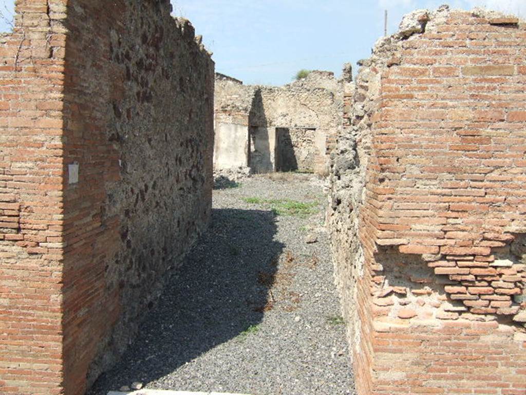 VII.6.30 Pompeii. September 2005. Looking north from entrance doorway. According to Spano in NdS,  a staircase made of masonry and lava-stone would have been on the right shortly after the entrance doorway. Also on the right was a small latrine. See Spano in Notizie degli Scavi, 1910, p.481.
By 1873 only the entrance and fauces or entrance corridor had been excavated, according to Fiorelli. See Pappalardo, U., 2001. La Descrizione di Pompei per Giuseppe Fiorelli (1875). Napoli: Massa Editore. (p.160)
According to Della Corte, he surmised that Petutio Quintioni  would have been the dweller in this house, judging by an amphora found in the atrium. This amphora was addressed to Petutio Quintioni, and had been sent from Pompeius Onesimus. See Della Corte, M., 1965.  Case ed Abitanti di Pompei. Napoli: Fausto Fiorentino. (p.172)