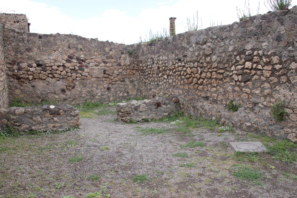 VII.7.1 Pompeii. May 2024. 
Looking towards north-east corner of shop-room, with doorway in north wall to rear room. Photo courtesy of Klaus Heese.