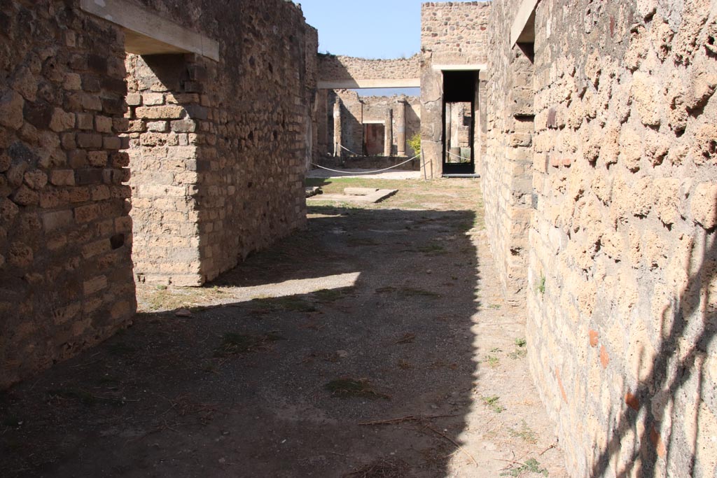 VII.7.2 Pompeii. October 2023. 
Looking north along entrance corridor “a”, with doorway to room “b” on left, and room “c” on right. Photo courtesy of Klaus Heese.