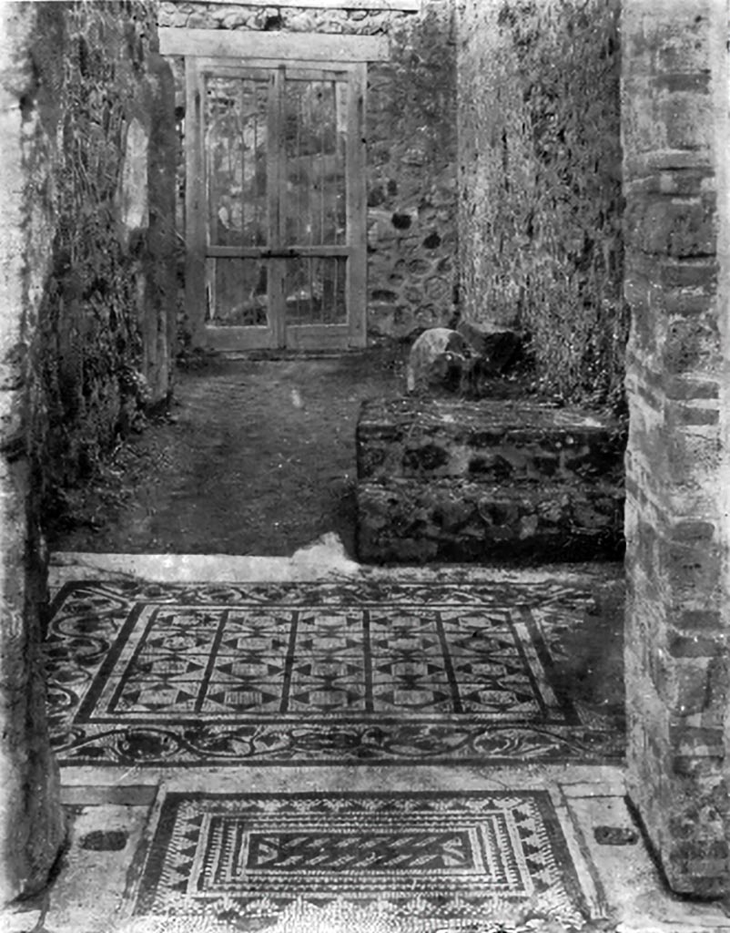 VII.7.5 Pompeii. c.1930. 
Looking across flooring in corridor/room (r), at the rear an ivy-leaf design enclosing a simple geometric pattern.
See Blake, M., (1930). The pavements of the Roman Buildings of the Republic and Early Empire. Rome, MAAR, 8, (p.81 & Pl.23, tav. 2).