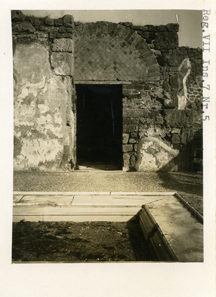 VII.7.5 Pompeii. Pre-1937-39. 
Looking east across impluvium in atrium towards doorway to room g, in centre of east side of atrium. 
Photo courtesy of American Academy in Rome, Photographic Archive. Warsher collection no. 1443.